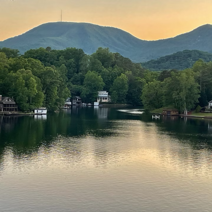 A quiet mountain lake at sunset